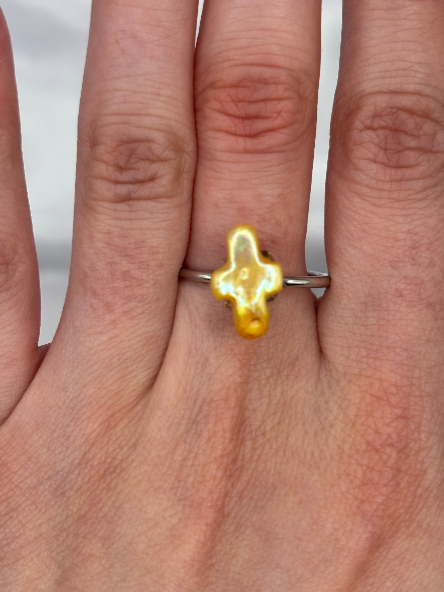 Yellow cross ring